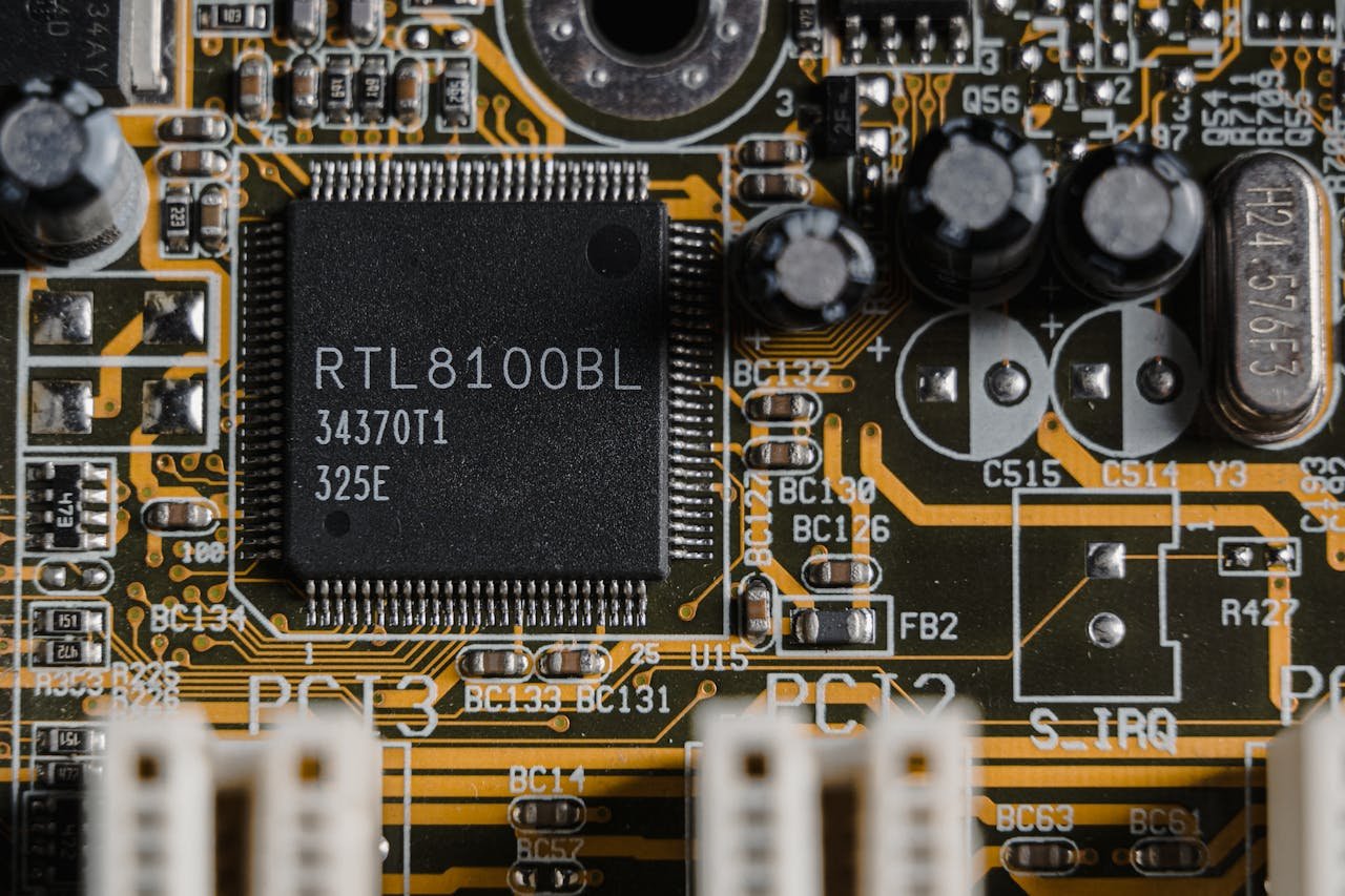 about-01 Detailed image of a motherboard highlighting a RTL8100BL microchip.